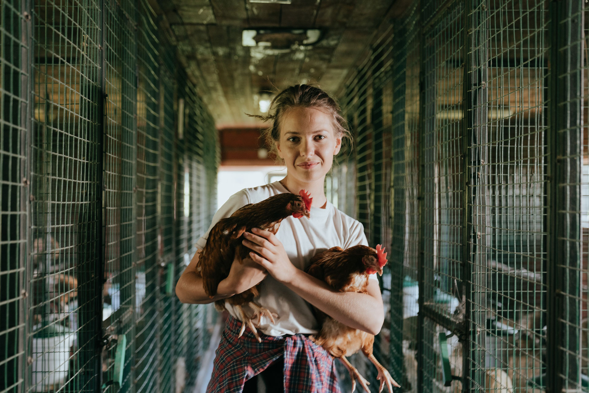 Girl holding chickens